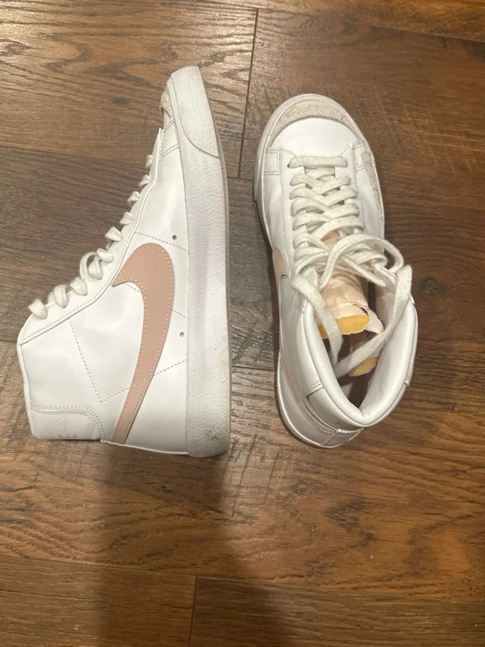 Nike Women's White High-Top Sneakers with Pink Swoosh Accent